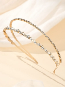 Détail d'un ensemble de deux serre-têtes dorés avec strass marquise et cristaux