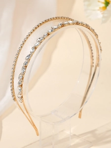 Détail d'un serre-tête doré à double rangée de strass et cristaux marquise pour mariages