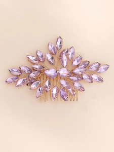 Close-up of handmade purple marquise crystal bridal hair comb with gold wire branches