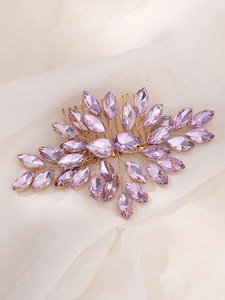 Detailed close-up of handmade bridal hair comb with purple marquise crystals and gold wire