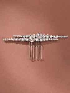 Detailed view of silver bridal hair comb with two rows of sparkling clear zircons