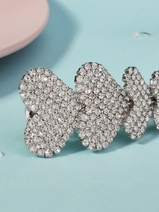 Close-up of sparkling silver butterfly hair clip with premium white rhinestones inlay