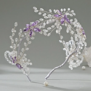 Luxurious bridal headband featuring handcrafted purple crystal flowers and beaded vines