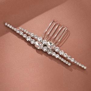Elegant silver bridal hair comb with shimmering zircons and rhinestones for weddings
