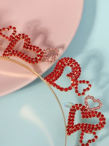 Close-up of golden headband with red rhinestone hearts for girls party headwear
