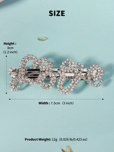 Detail view of silver LOVE hair clip with sparkling rhinestones and 7.5cm width measurement
