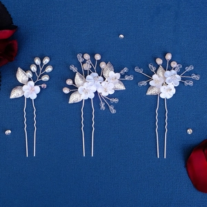 Three-piece bridal hair pin set with handmade white clay flowers, pearls, and crystals