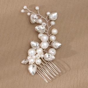 Detailed close-up of handmade bridal hair comb with pearls and teardrop rhinestones