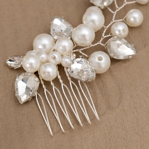 Bridal hair comb with white pearls and sparkling pear-shaped rhinestones on silver wire