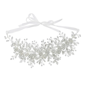 Detail of bridal beaded headband with crystals, frosted petals and white satin ribbons