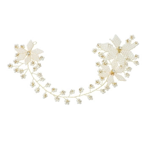 Detail of white pearl flower hair vine with sparkling rhinestones for bridal hair