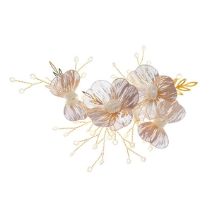 Close-up of handmade floral hair comb with translucent peach petals and faux pearls