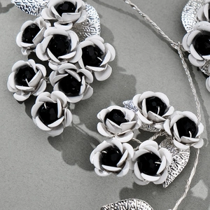 Dark aesthetic bridal flower headband with black gems and silver metallic leaves