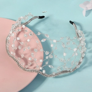 Detailed close-up of handmade crystal grid headband with silver wire and white beads