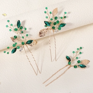 Gold leaf and emerald crystal bridal hair comb set for elegant Chinese wedding updos