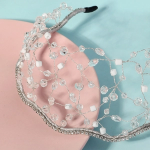 Detailed macro view of handmade crystal bridal headband with mesh wire and silver beads