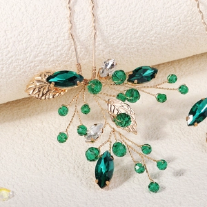Exquisite bridal hair pin set with handmade gold leaves and green crystals