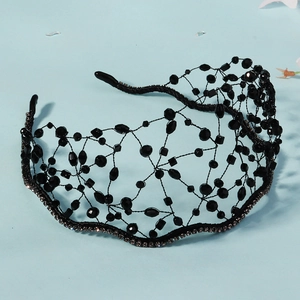 Detailed top view of handmade black crystal mesh headband with luxury rhinestone base