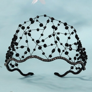 Detailed view of handmade black crystal mesh headband with gothic beads and rhinestones