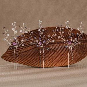 Three-piece bridal hair pin set with purple crystals and silver floral wire branches
