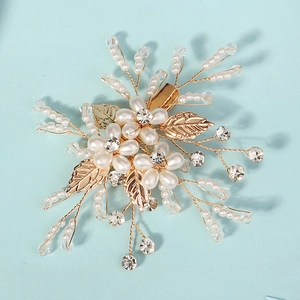 Elegant floral bridal hair clip with white pearls and sparkling crystals on gold frame