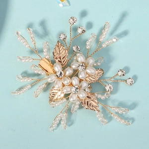 Handmade gold floral hair clip with white pearls and sparkling crystals for bridal styling