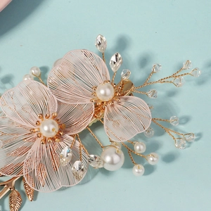 Exquisite bridal hair clip with pink wire petals, elegant pearls and sparkling crystals