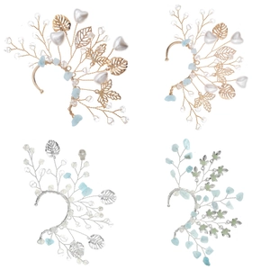 Detail of handmade crystal and leaf ear cuffs with blue stones and pearls for non-pierced ears