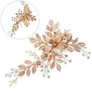 Handmade bridal hair clip with rose gold flowers, pearls and crystals on white background