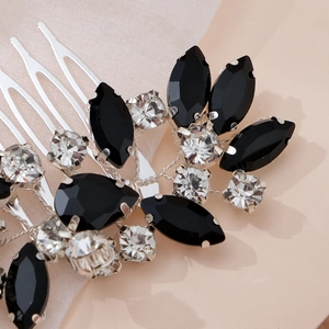 Macro detail of handmade bridal hair comb with black crystals and silver wiring