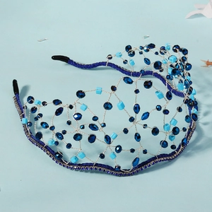 Close-up of blue crystal mesh headband with hand-woven beads for wedding accessories
