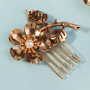 Elegant gold flower hair comb with pearl inlay and detailed leaf engraving for women