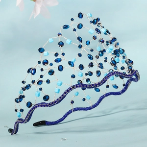 Detailed close-up of handmade crystal grid headband with blue beads and silver wire weaving