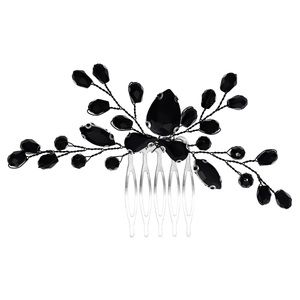 Macro shot of silver bridal hair comb with black crystals and hand-wired branch detail
