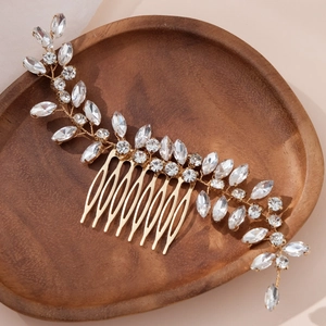 Elegant gold bridal hair comb with leaf-shaped crystals and rhinestones for wedding