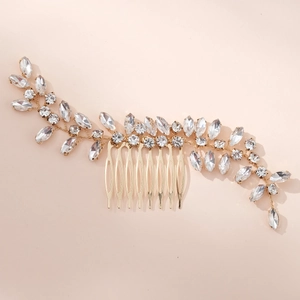 Detailed view of handmade crystal bridal hair comb with golden leaf and rhinestone design