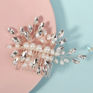 Elegant silver bridal hair comb with white pearls and crystal leaves for weddings