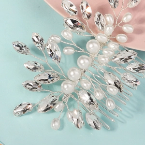 Detailed view of handmade silver bridal hair comb with pearls and marquise rhinestones