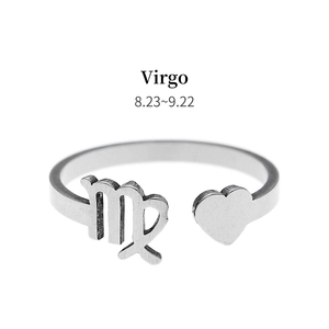 Detail view of silver Virgo zodiac ring with heart motif and constellation symbol