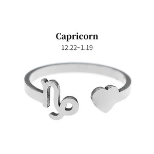 Detail view of Capricorn zodiac sign and heart on silver adjustable stainless steel ring