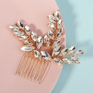 Elegant gold leaf bridal hair comb featuring marquise crystals for wedding hair styling
