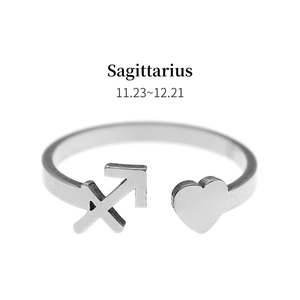 Detail view of silver Sagittarius zodiac ring with heart charm and adjustable band