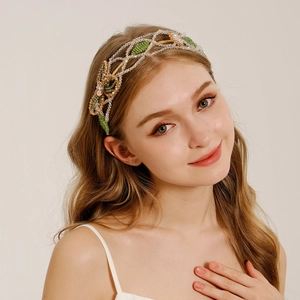 Detailed shot of handmade crystal beaded floral headband on model with elegant green beads