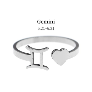 Detail of Gemini zodiac symbol and heart on adjustable silver stainless steel ring