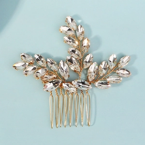 Detail view of handmade bridal hair comb with marquise crystals and gold wire branch