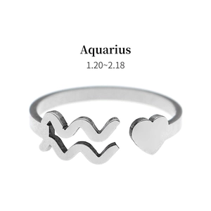 Detail of silver Aquarius open ring with heart element and zodiac wave engraving