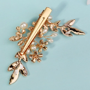 Handmade golden leaf hair clip with white pearls for elegant bridal hairstyles