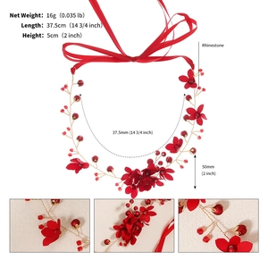 Detail view of red fabric flowers and crystal beads on a 37.5cm bridal hairband