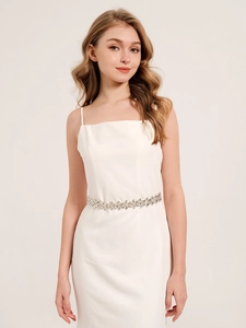 Detailed view of bridal white dress with sparkling flower rhinestone waist belt for weddings