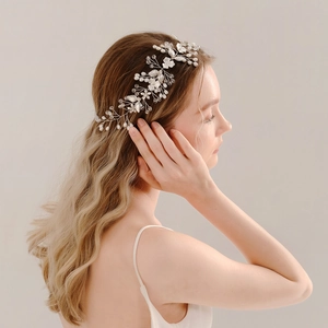 Elegant bridal hairband with white pearls and silver metal leaves for wedding hairstyles